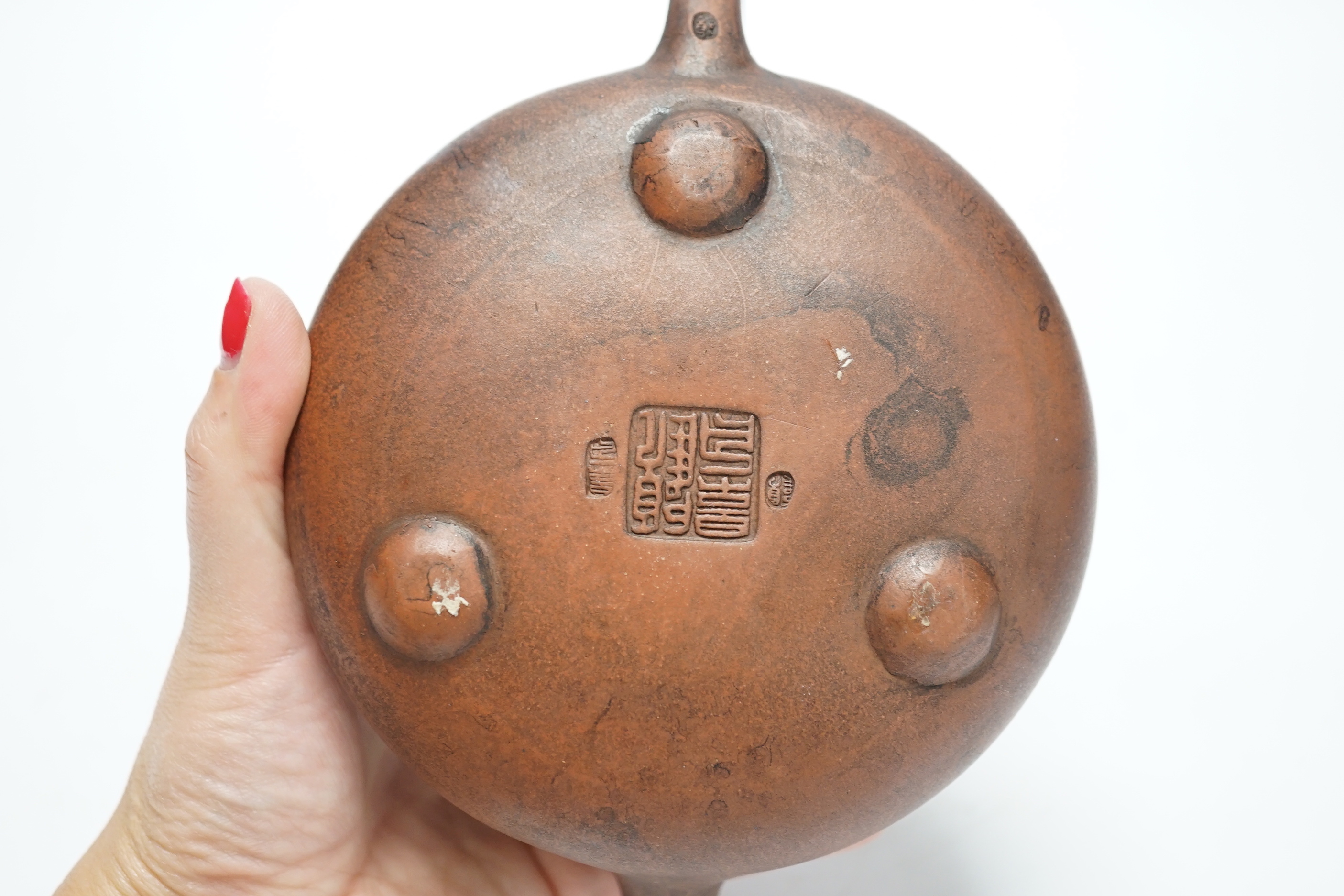 A Chinese Yixing teapot and cover, 8cm tall